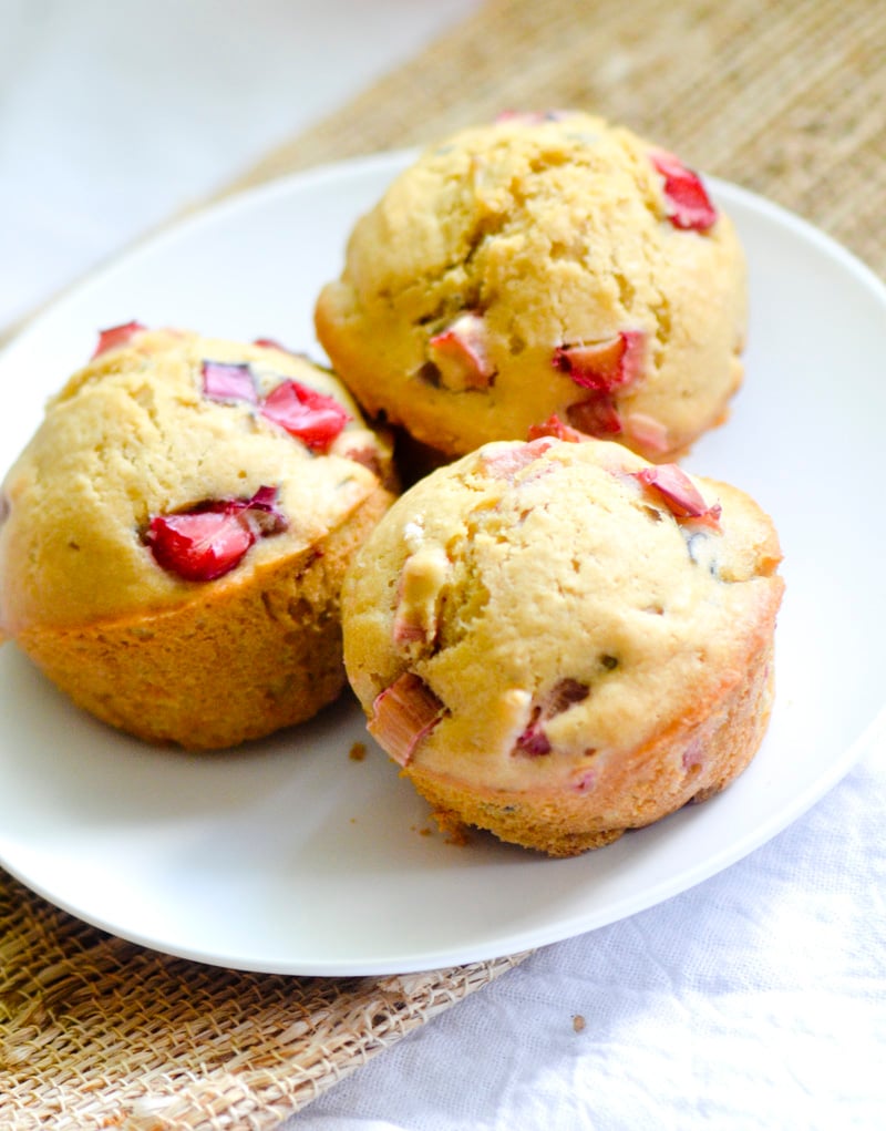 3 Rhubarb muffins sitting on an white plate. 