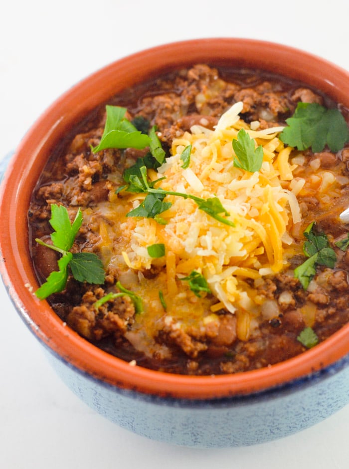 Beef and chorizo chili topped with cheese and fresh cilantro.