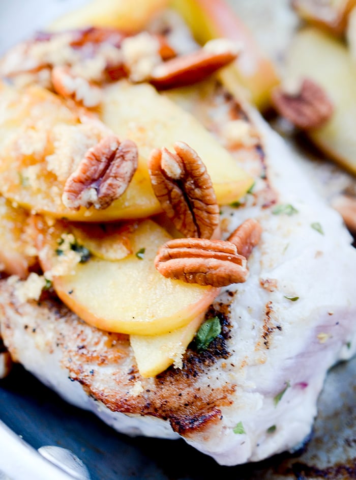 One Skillet Pork Chops and Apples - Apples and Pork Chops cooked together in one skillet and topped with pecans and maple syrup! Hardly no clean up necessary.