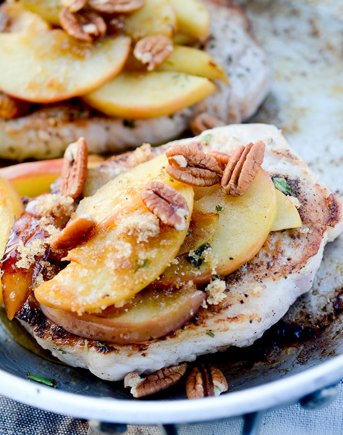 One Skillet Pork Chops and Apples - Apples and Pork Chops cooked together in one skillet and topped with pecans and maple syrup! Hardly no clean up necessary.