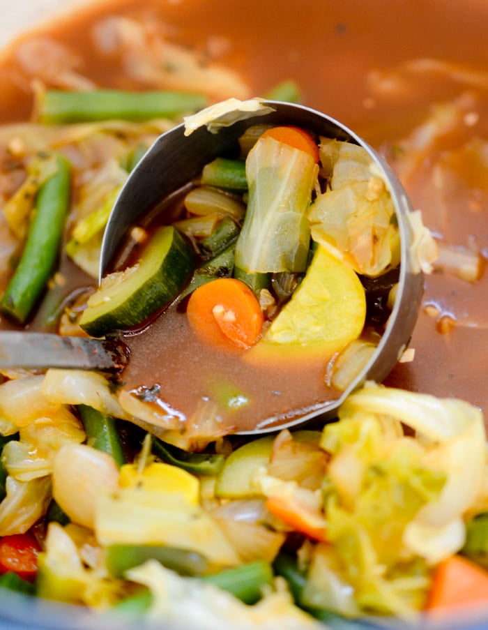 finished product of zero point cabbage soup with a soup spoon for serving