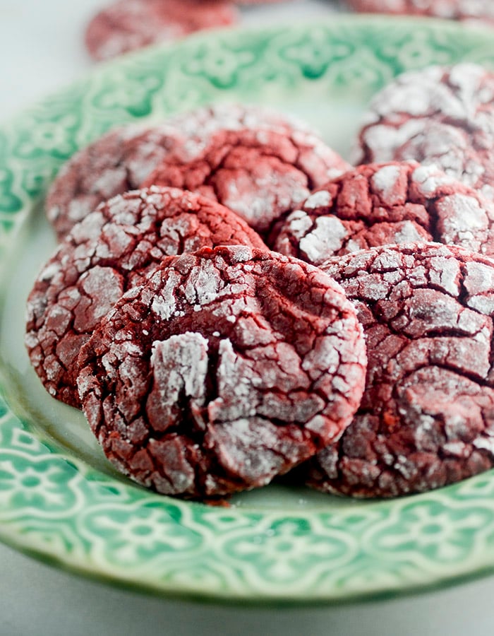 Red Velvet Crinkle Cookies - these cookies are made with a box cake mix and rolled into powdered sugar! The perfect cookie to make when you need to make something fast for the Holidays!