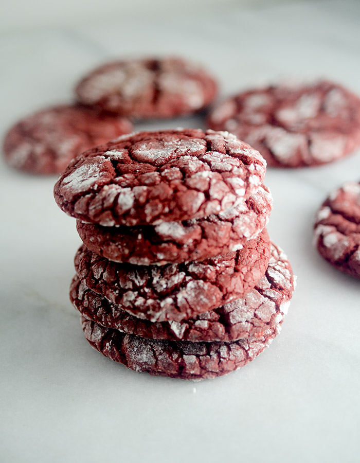 Red Velvet Crinkle Cookies - these cookies are made with a box cake mix and rolled into powdered sugar! The perfect cookie to make when you need to make something fast for the Holidays!