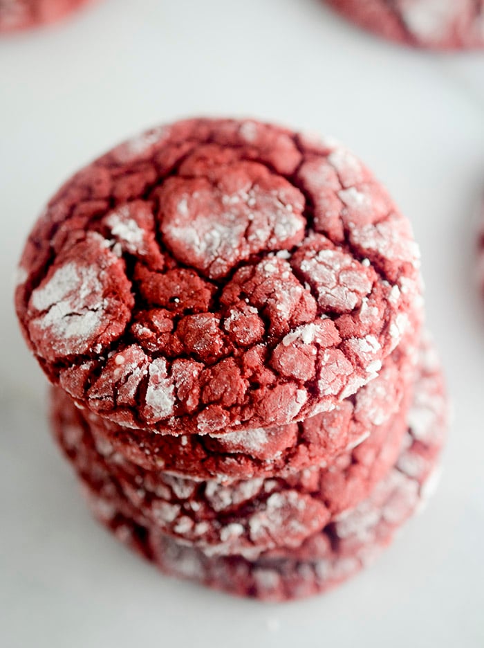 Red Velvet Crinkle Cookies - these cookies are made with a box cake mix and rolled into powdered sugar! The perfect cookie to make when you need to make something fast for the Holidays!