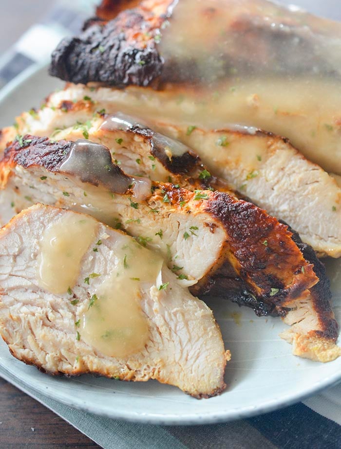 Seasoned air fryer turkey breast topped with gravy. 