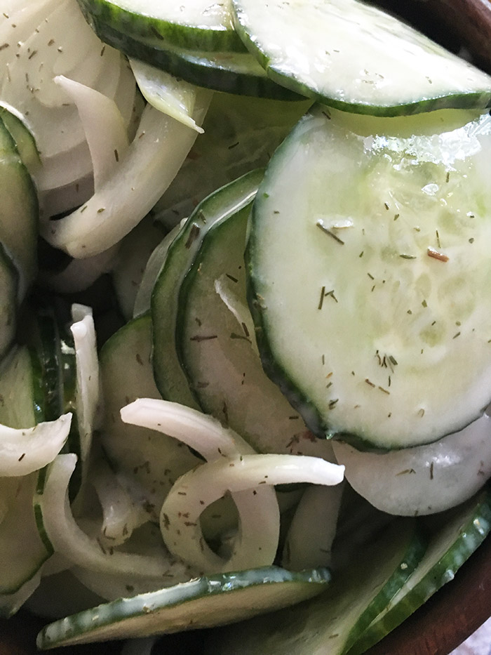Creamy Cucumber Salad is the cook out food you need to bring to your 4th of July party. Made with healthy zero point ingredients such as greek yogurt. 