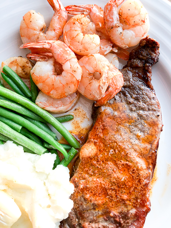 Air Fryer Surf and Turf with cooked green beans and mashed potatoes. 