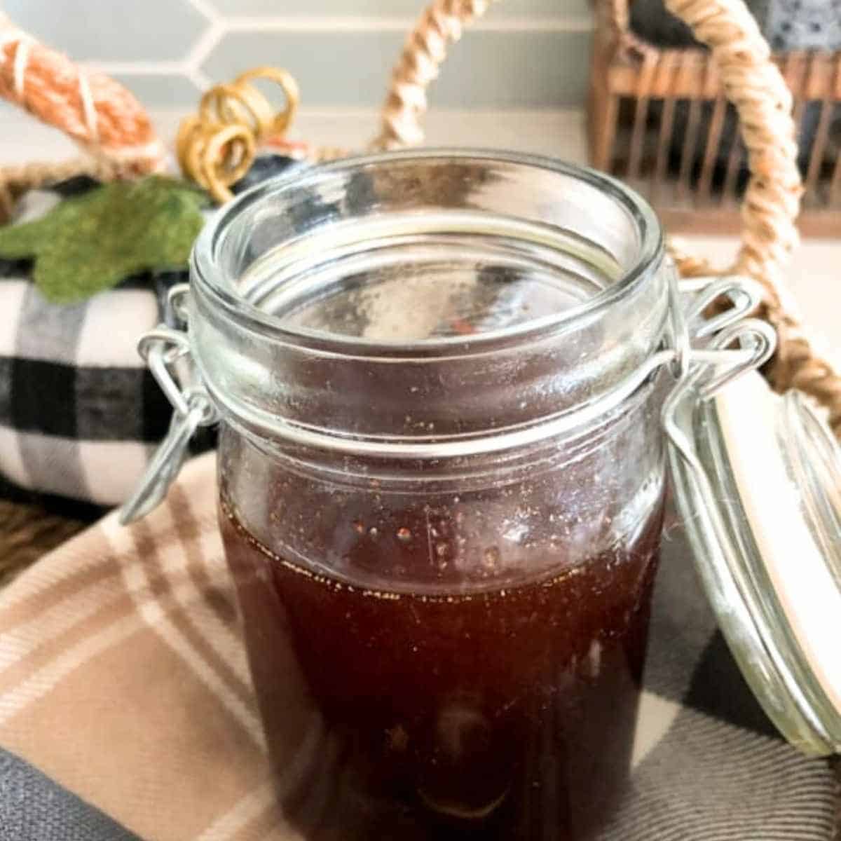 Pumpkin spice syrup in a clear glass jar ready for coffee. 