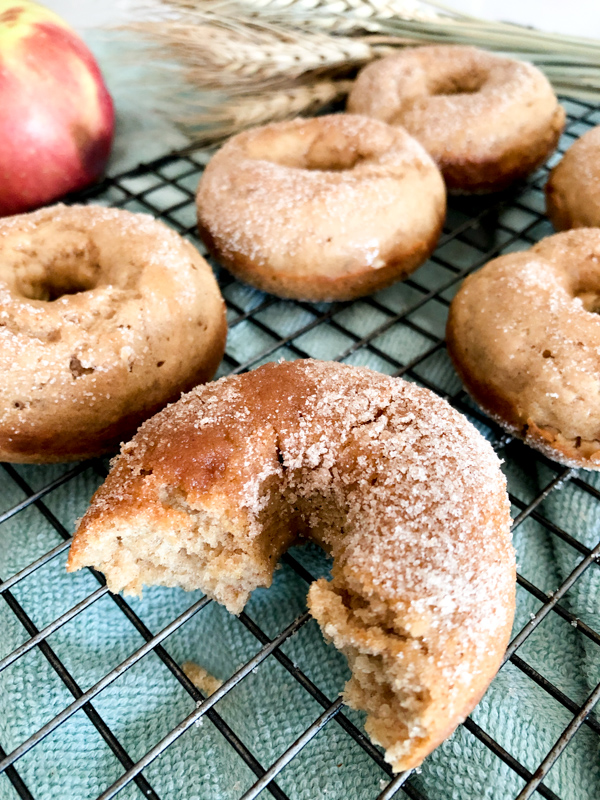 Baked Apple Cider Donuts on a baking sheet. 