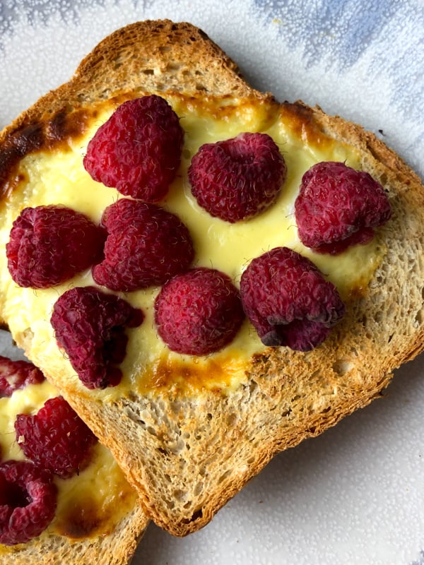 Custard toast is a piece of bread that has a custard filling in the center of the toast. You can top it with any type of fresh fruit you have available or defrost some frozen fruit