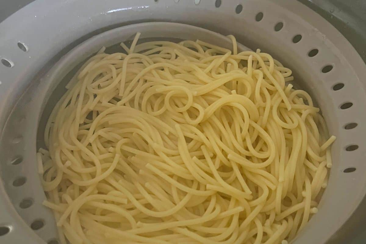 Boiled and cooked noodles drained in a strainer. 