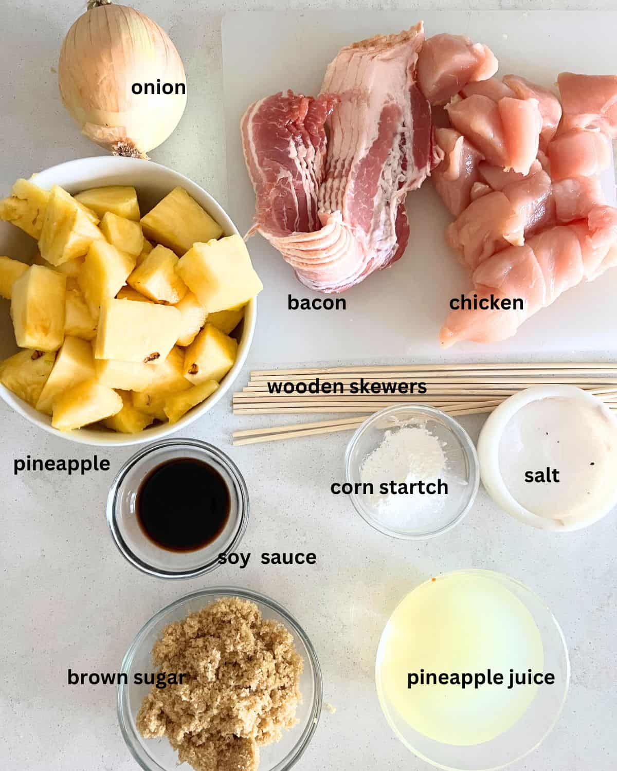 Ingredients needed for bacon, pineapple, and chicken kabobs. 