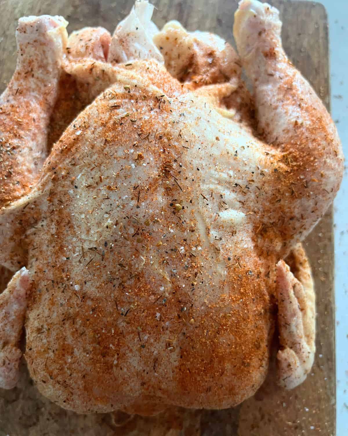 Seasoned brined chicken ready for grill or smoker. 