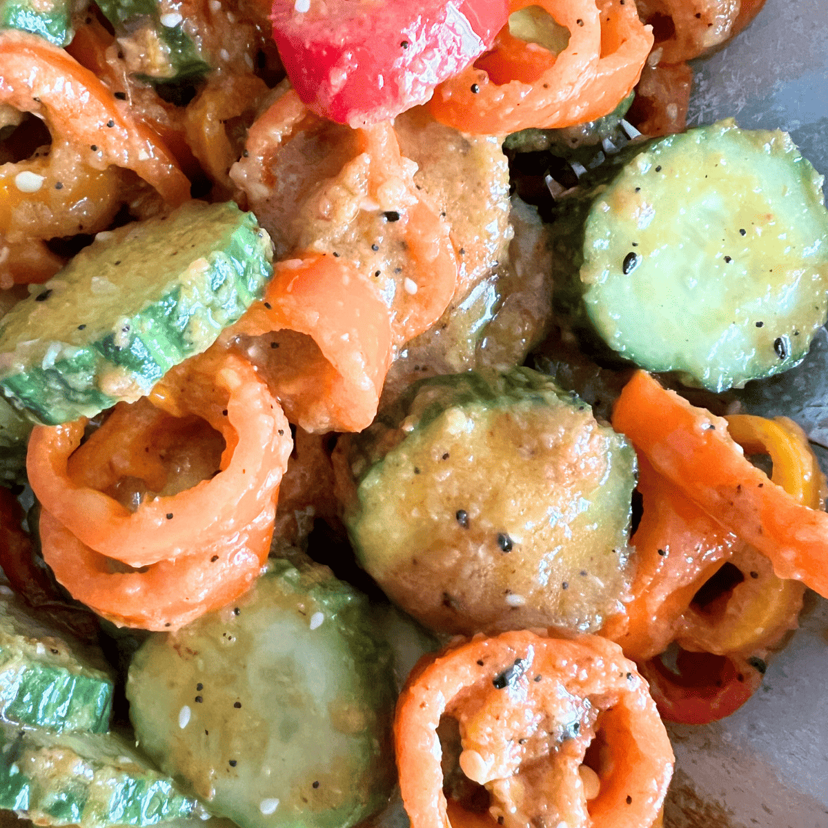 This fresh salad is made with crisp cucumbers and sweet mini peppers and you only need 5 ingredients to make it.  The combination of cucumbers, sweet peppers, and dressing, creates a delightful crunch and burst of flavor in every bite