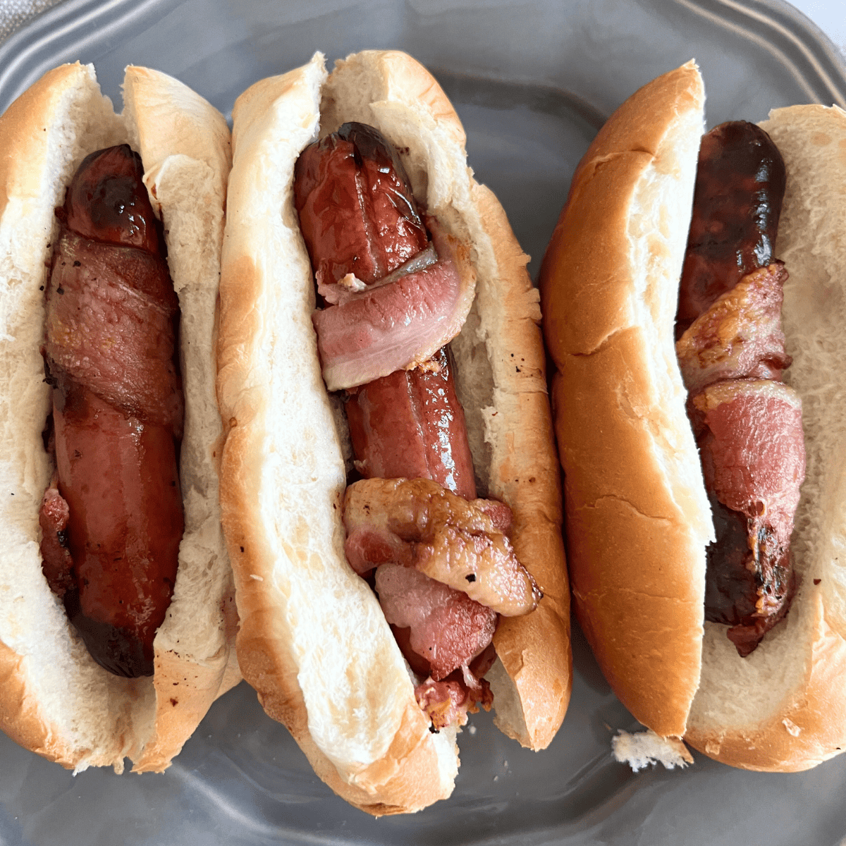How do you make a hot dog taste even better? Wrap it in some bacon of course! This bacon-wrapped hot dog is the best hot dog you will ever eat. 