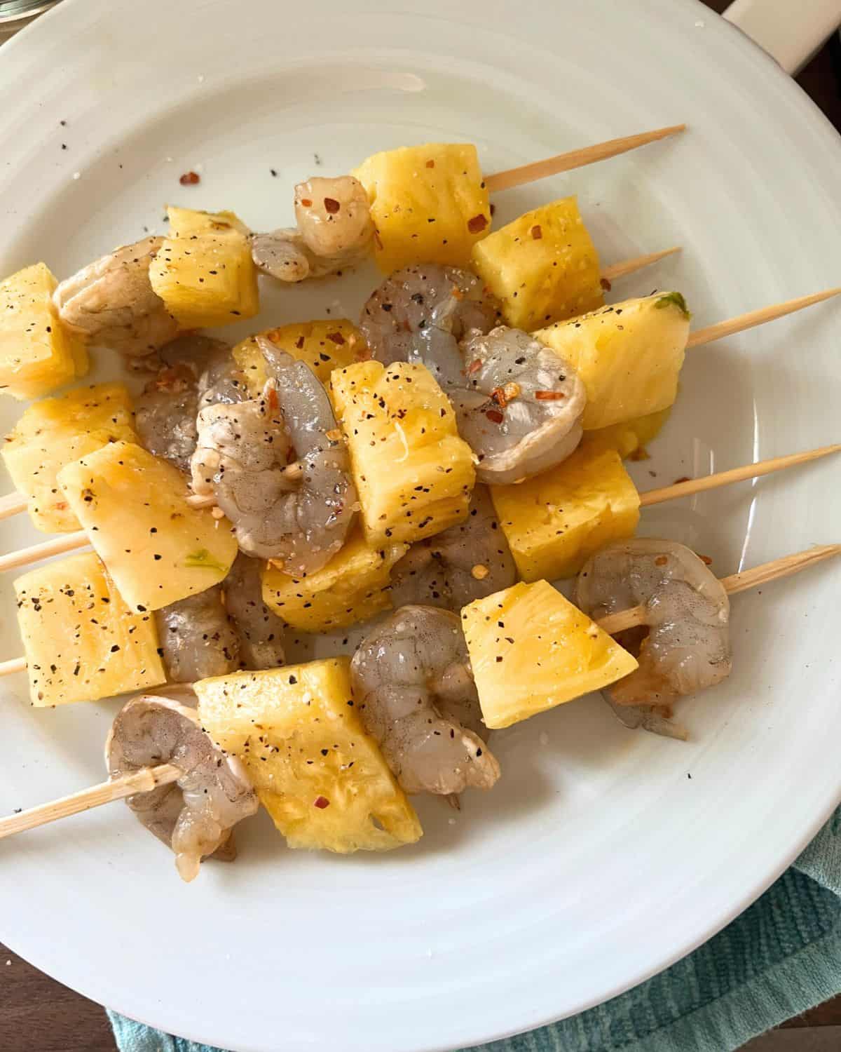 Shrimp and pineapple kabobs ready for grill. 