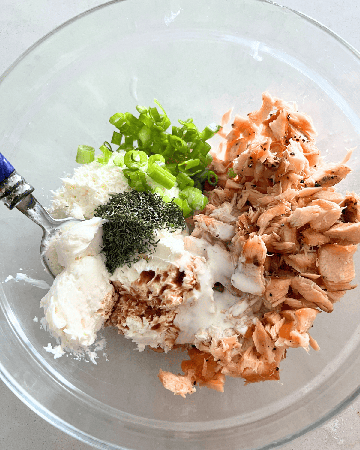 Smoked salmon ingredients all together in a bowl. 