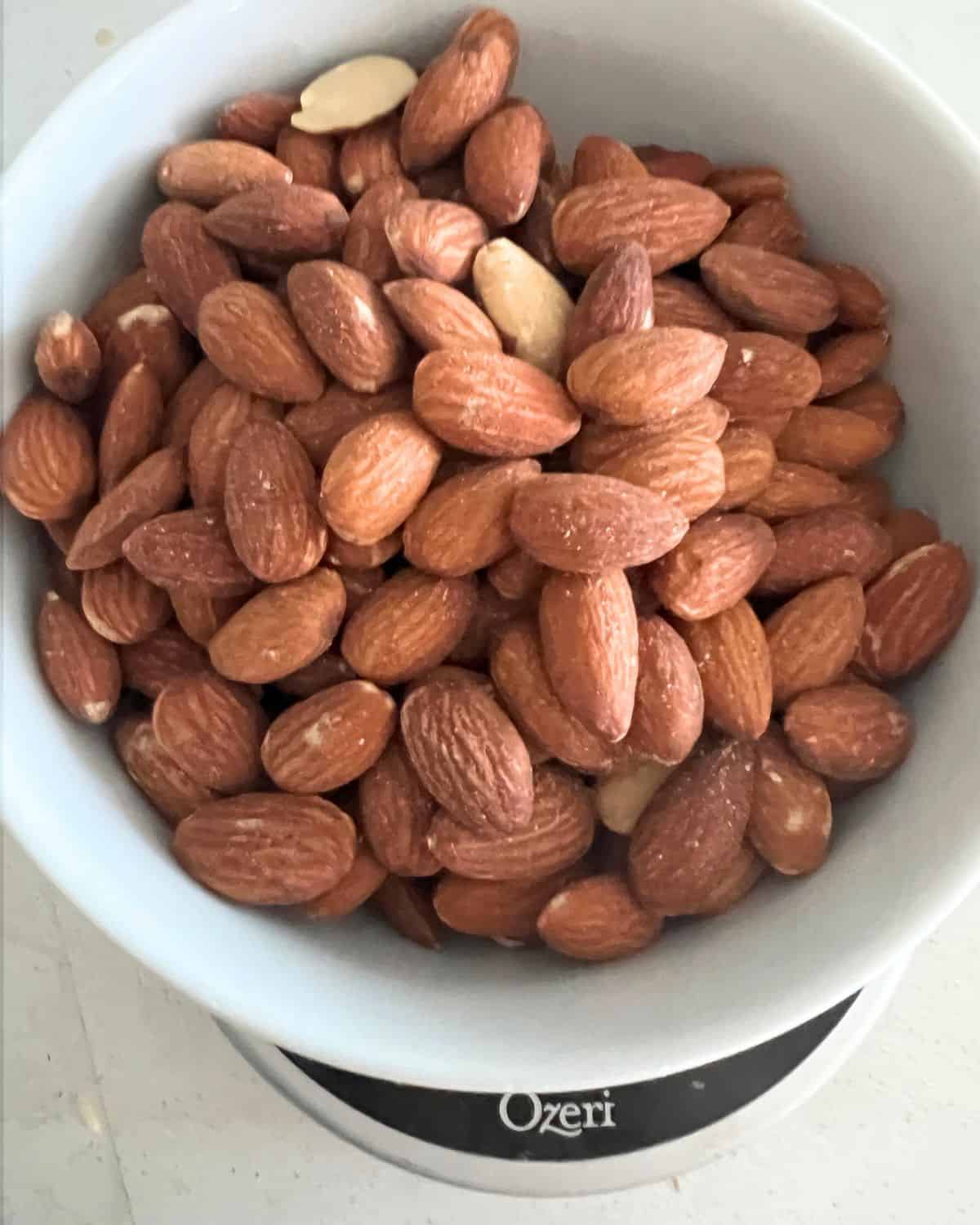 Weighed almonds on a food scale. 