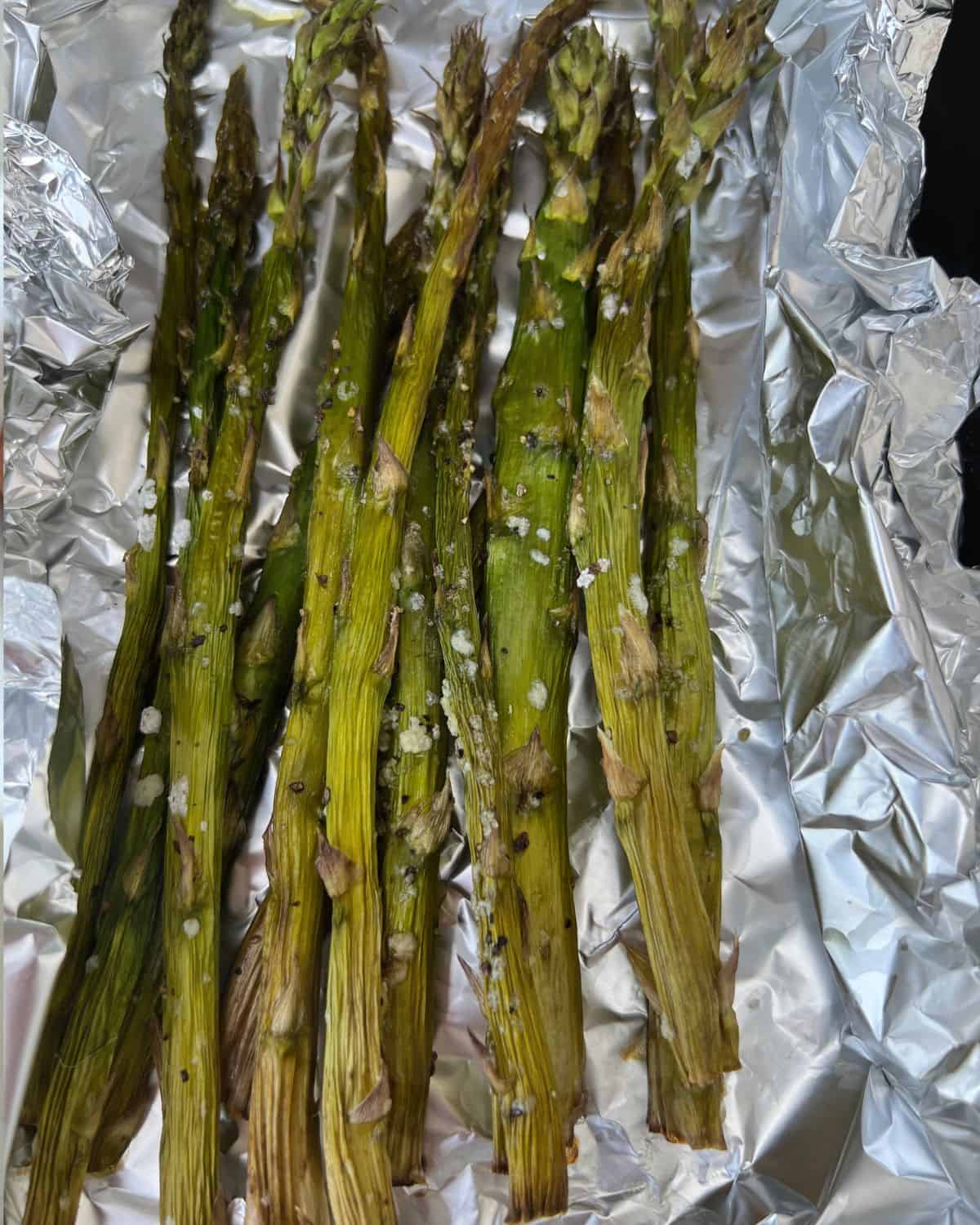 Seasoned smoked asparagus in foil. 