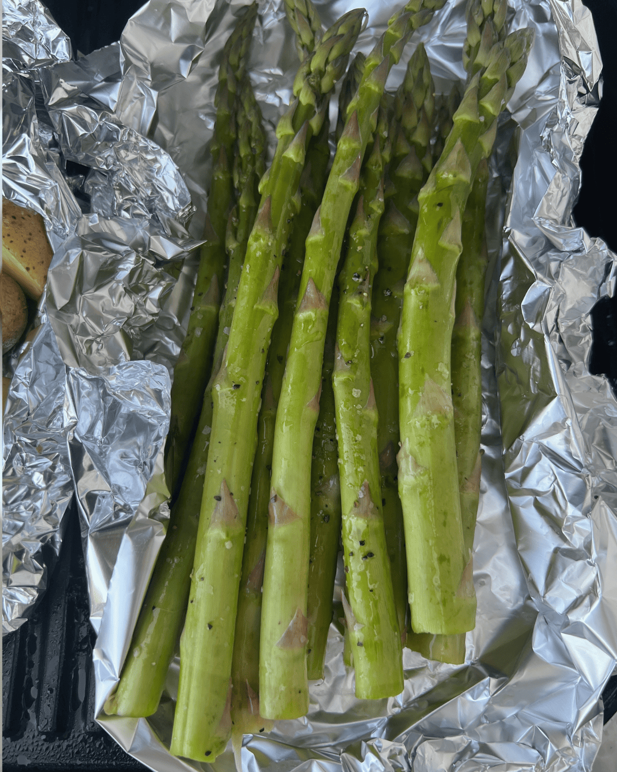Smoked asparagus in foil with salt, pepper, and olive oil. 
