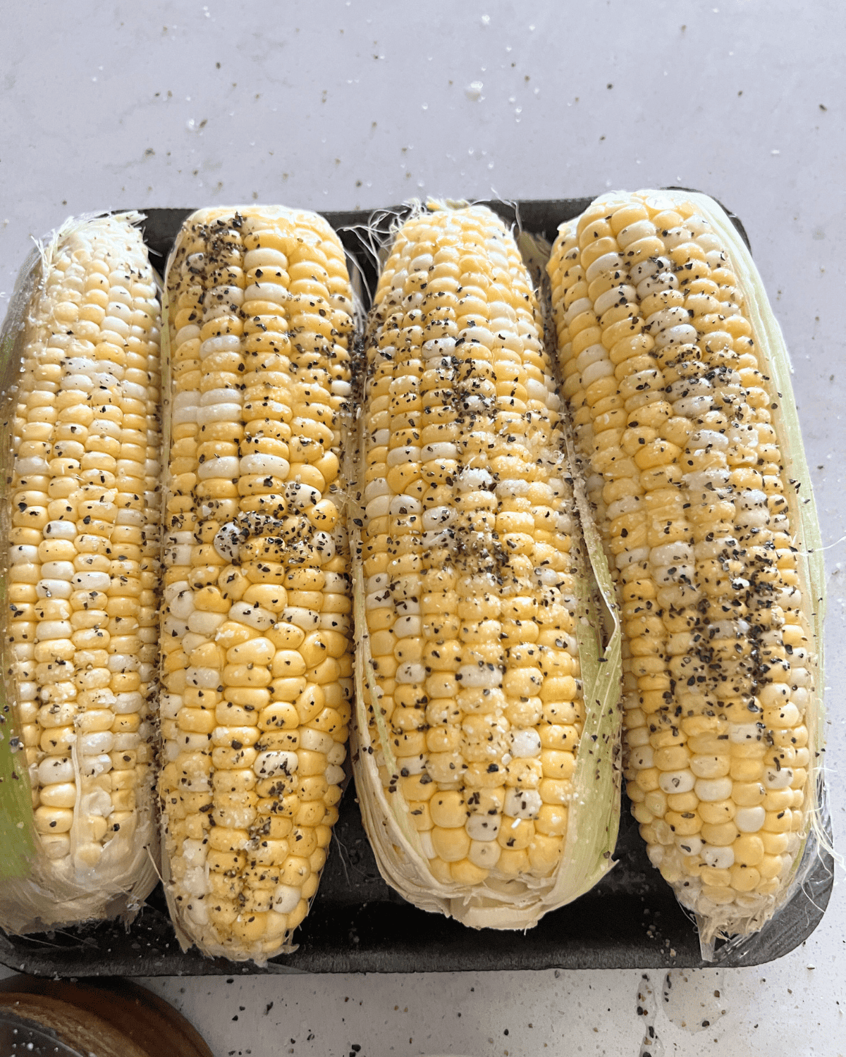 corn on the cob seasoned with just salt and pepper.