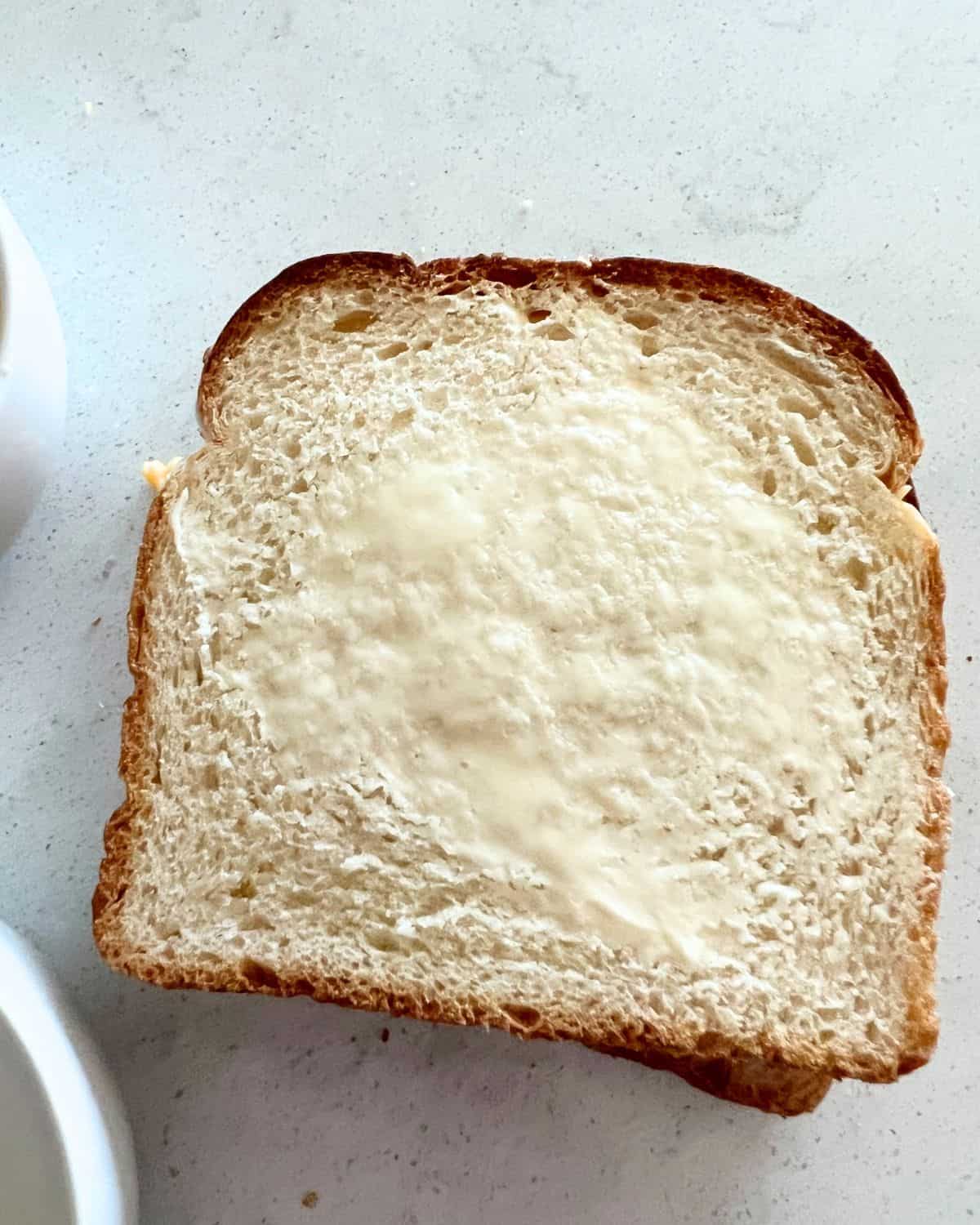 Buttered bread for air fryer grilled cheese sandwich. 
