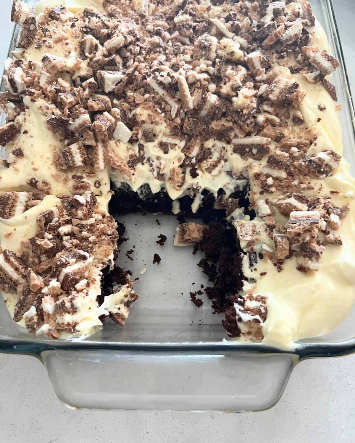 Better than Sex cake topped with vanilla pudding frosting and crushed up wafer cookies. 