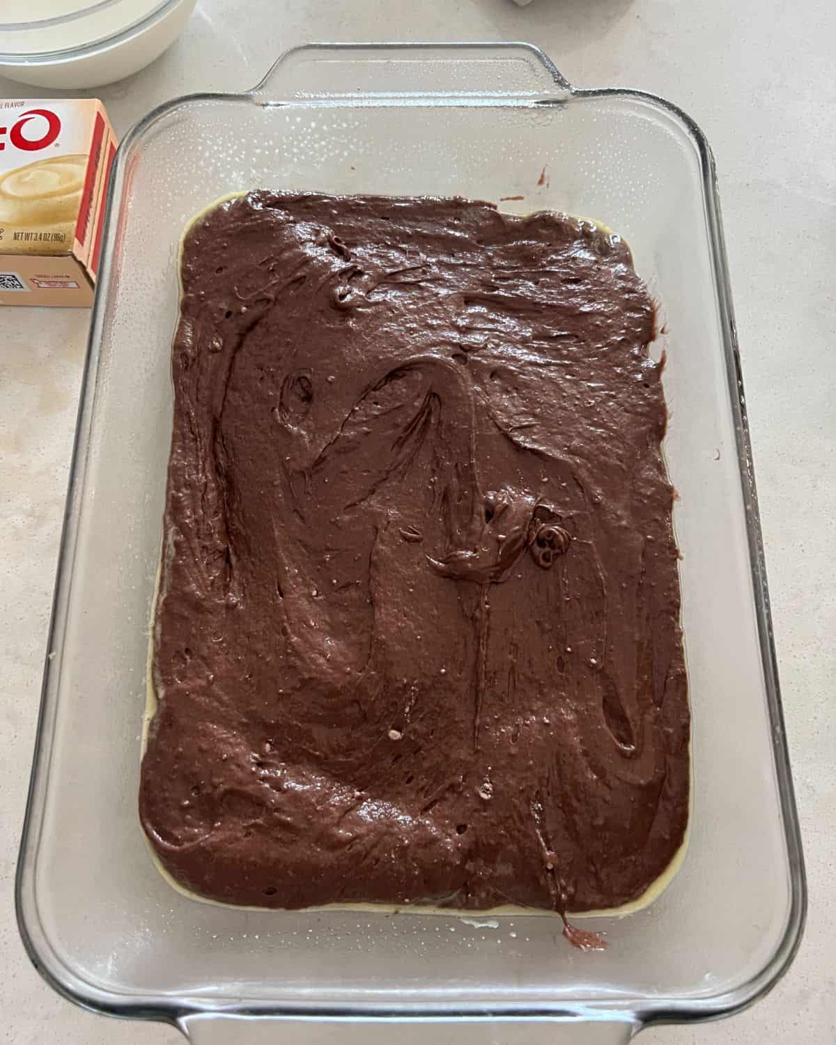 Chocolate cake mix and diet soda mix in a pan. 