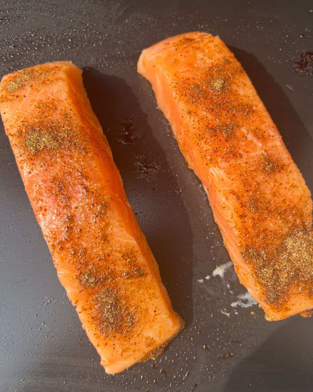 Seasoned salmon on a Blackstone Griddle. 
