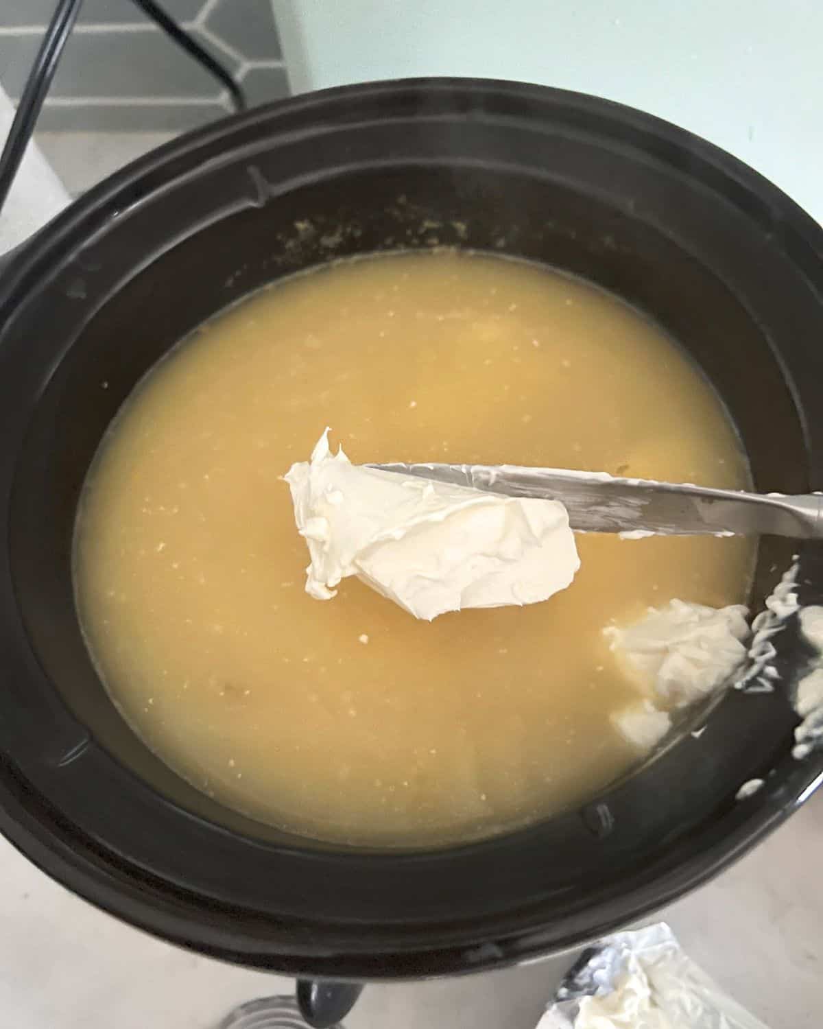 Cream cheese added to crock pot soup. 