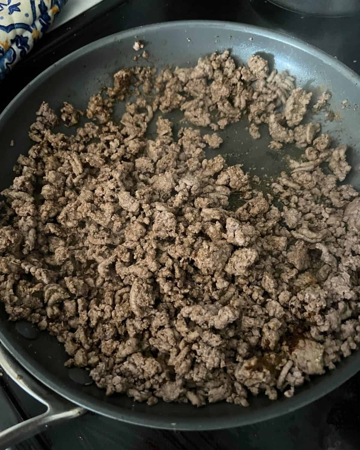 Grond Beef cooking in a skillet. 