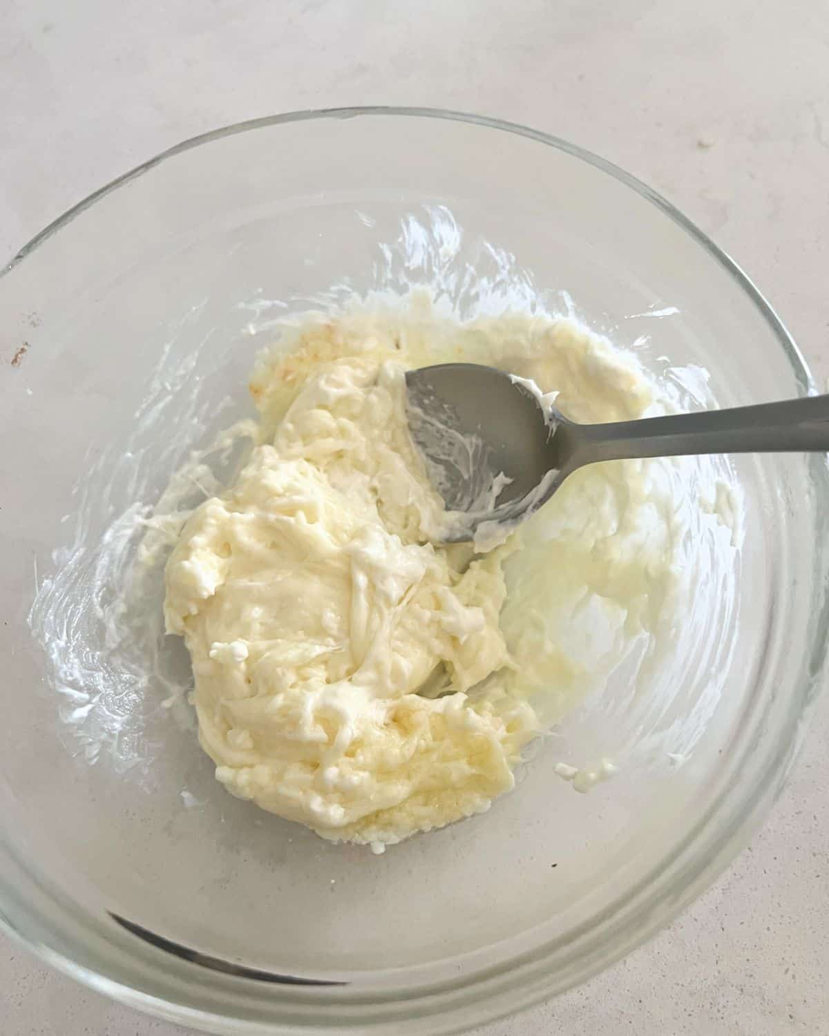 Cream cheese and mozzarella melted in a bowl. 