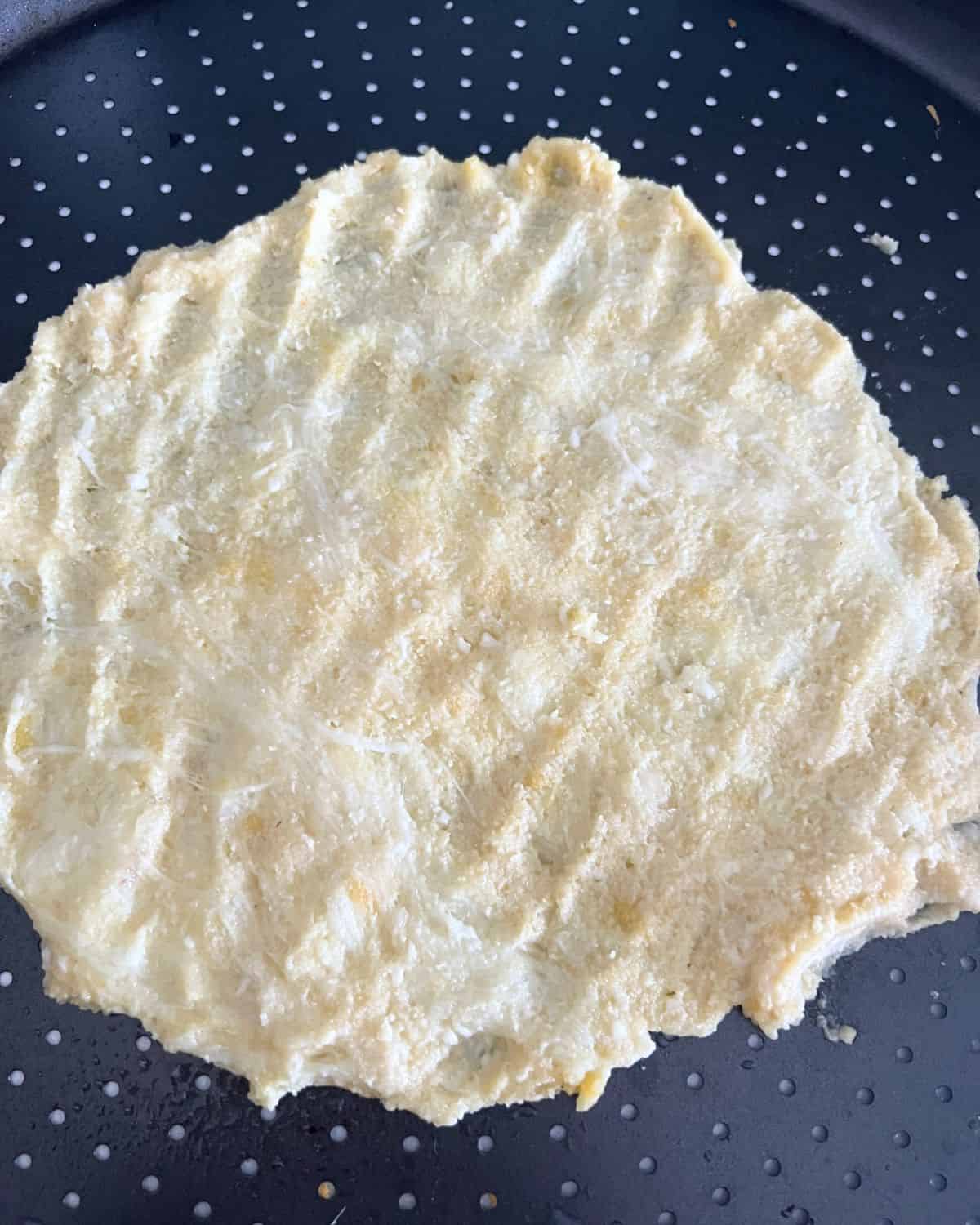 Fat head dough on pizza pan. 