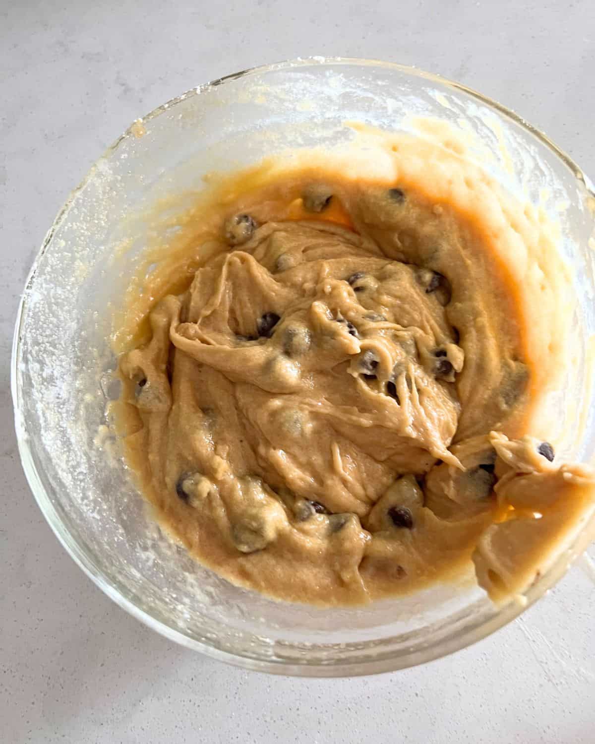 Cookie dough batter mixed together in a bowl. 