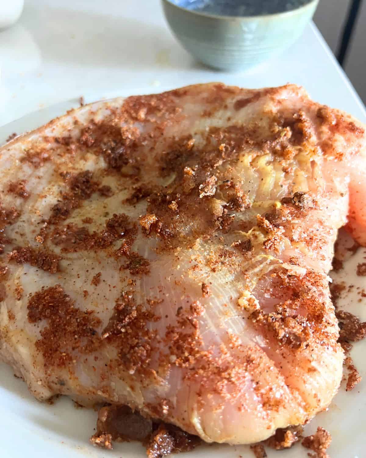 Rubbed turkey breast with butter and spices. 