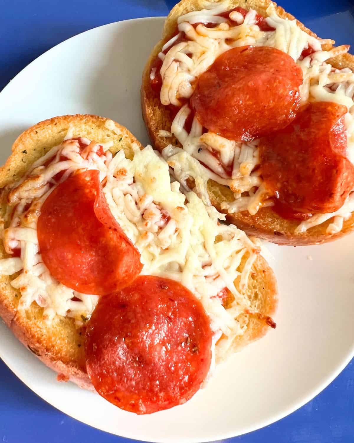 Completed Texas Toast Garlic bread pizza on a white plate. 