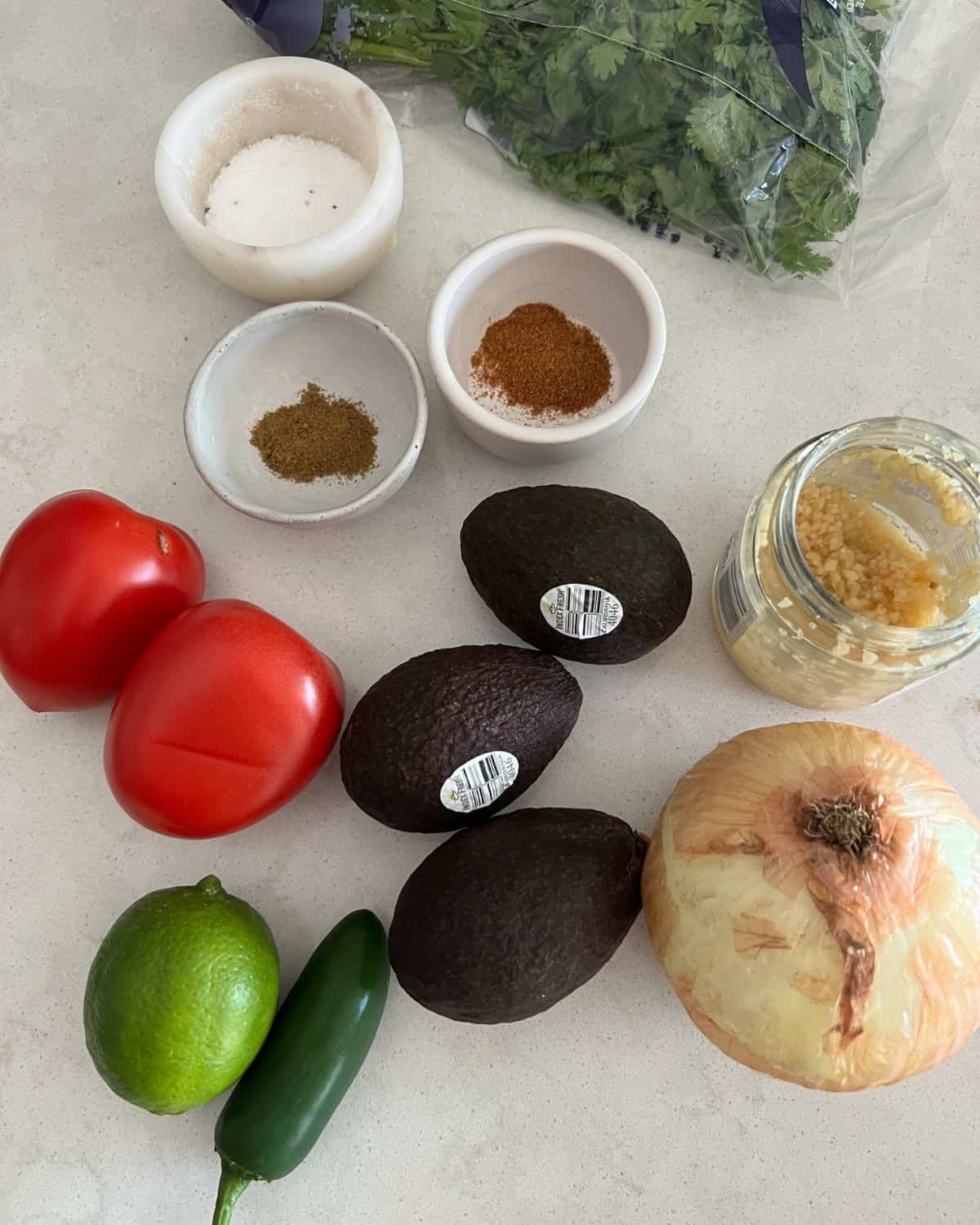 Ingredients needed for Alton Brown's Guacamole. 