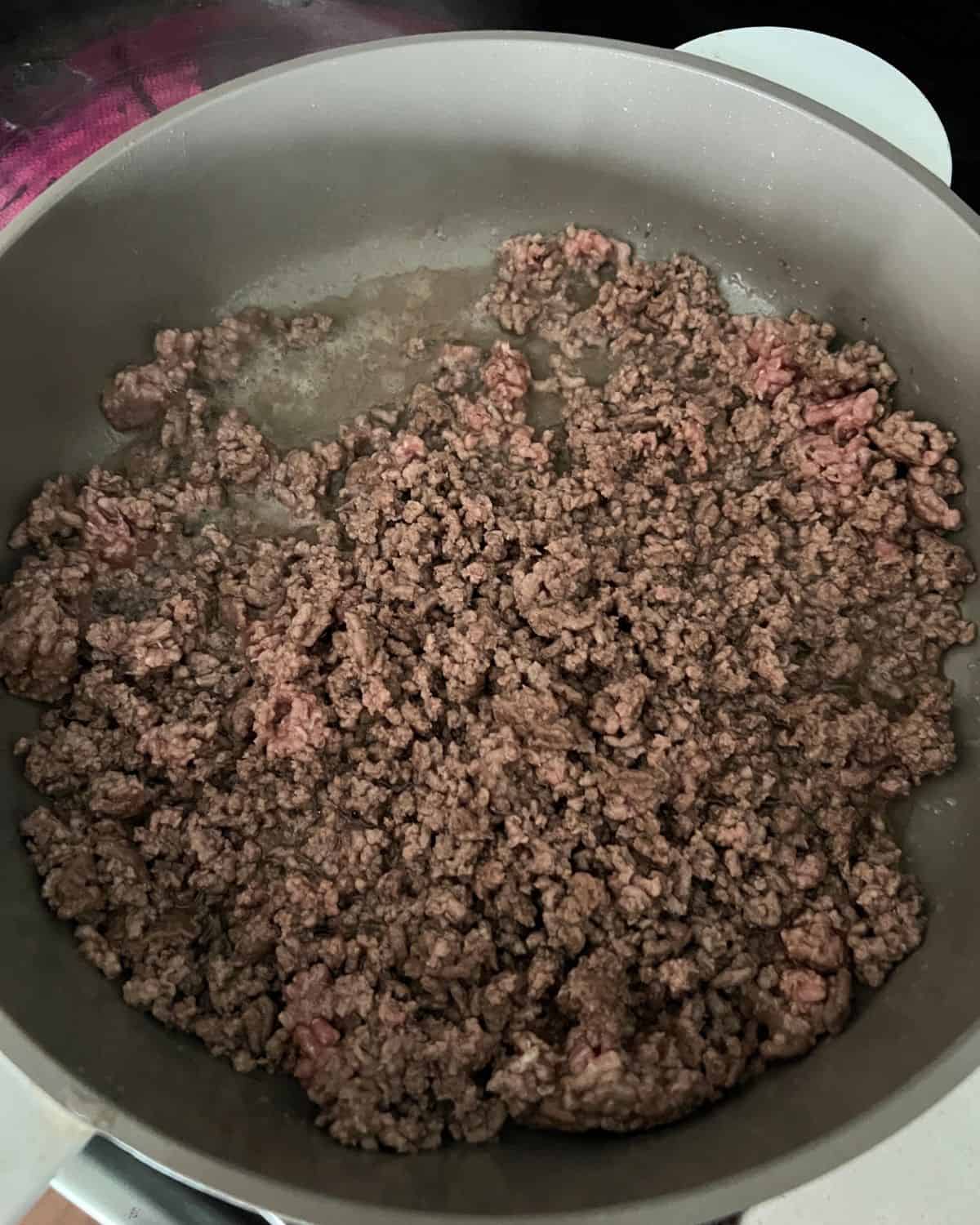 Browned ground beef in a skillet. 