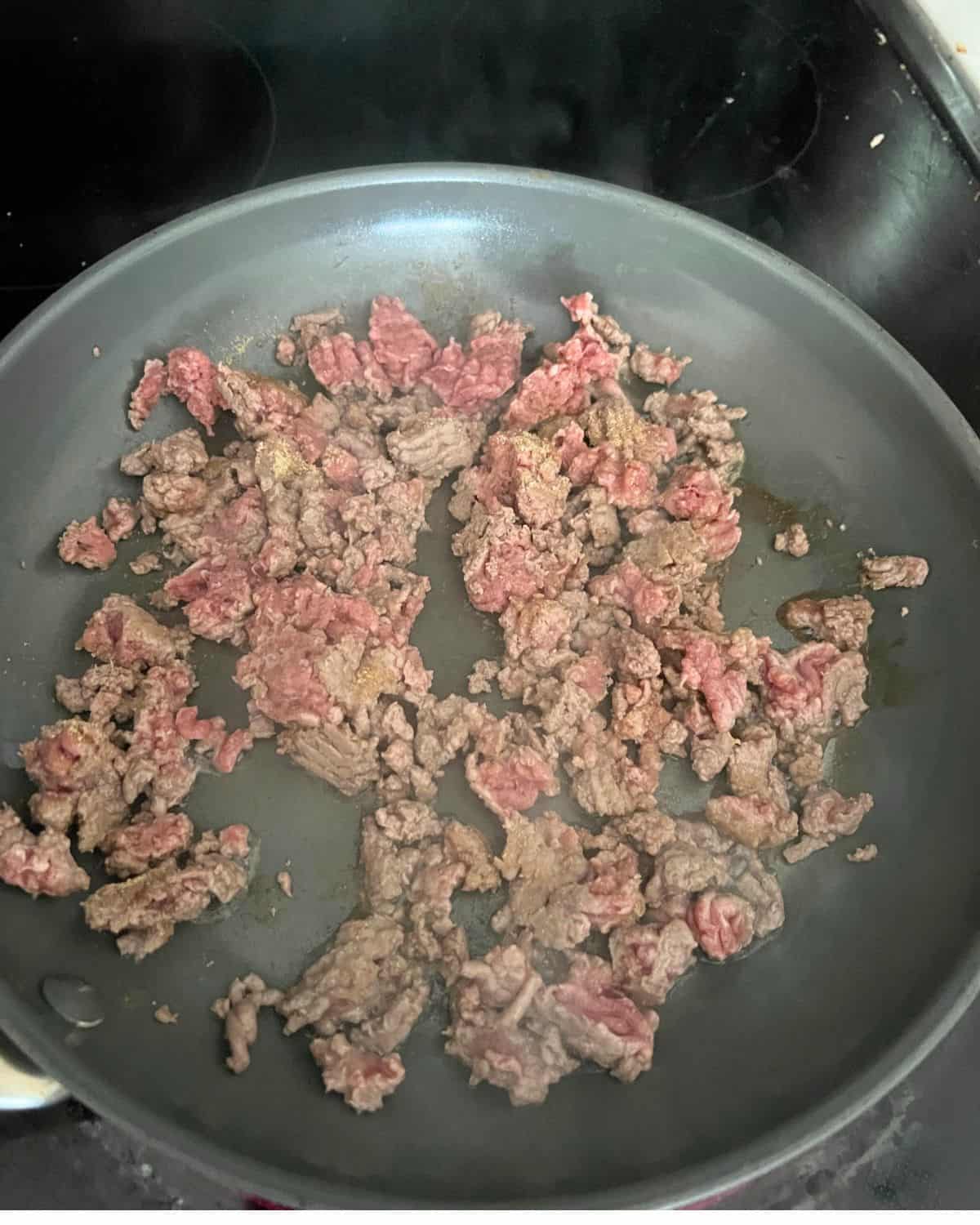 Cooked ground beef with onion and garlic powder. 