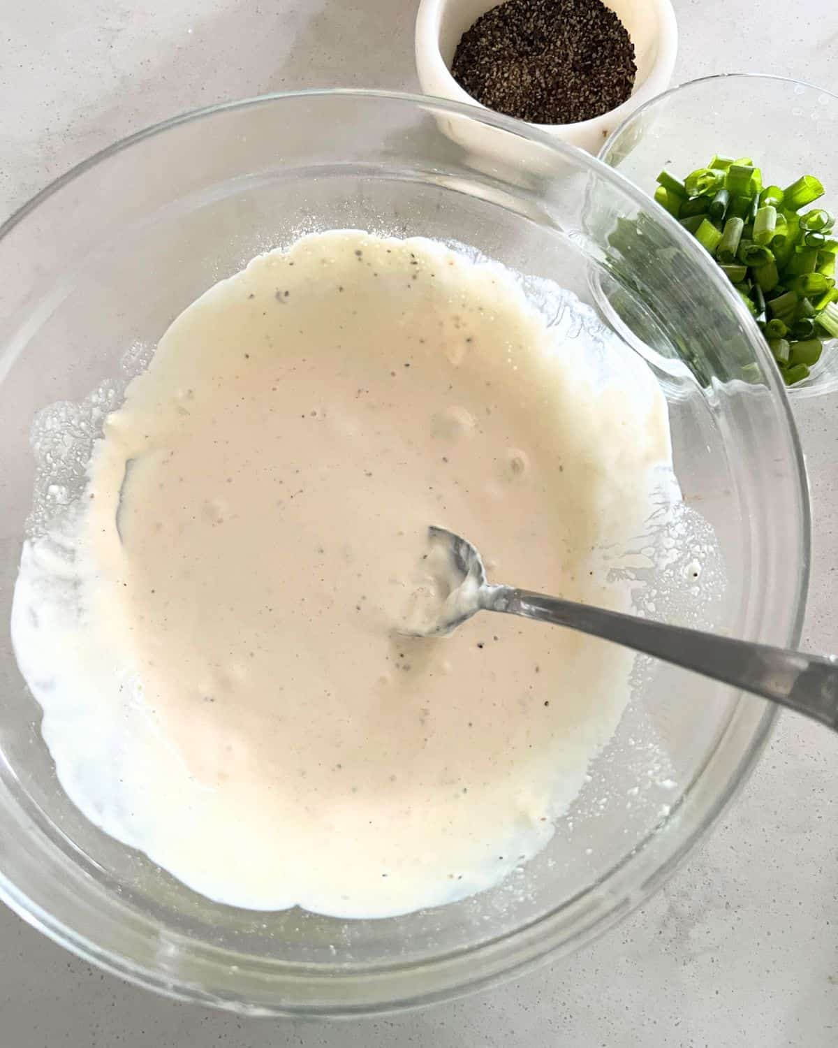 Dressing ingredients for pasta salad in a bowl. 