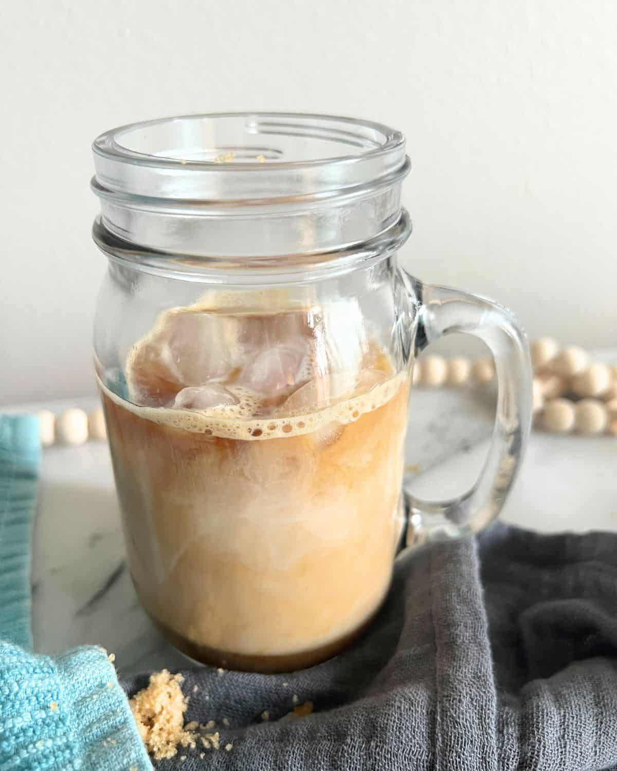 Brown Sugar Shaken Espresso poured into a glass jar. 