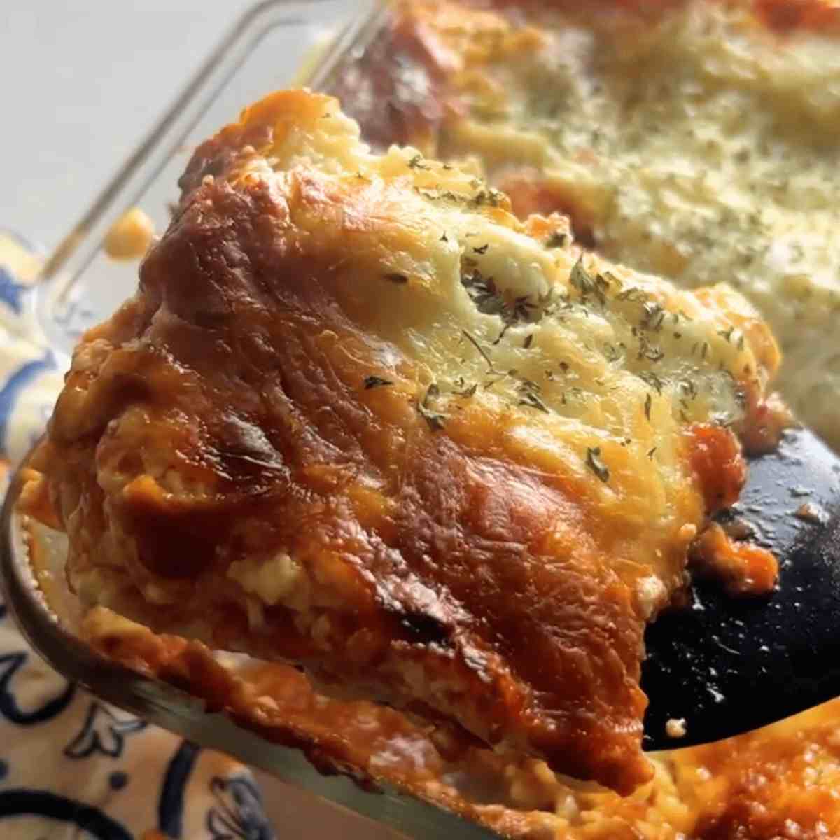 Finished buffalo chicken lasagna in a pan. 