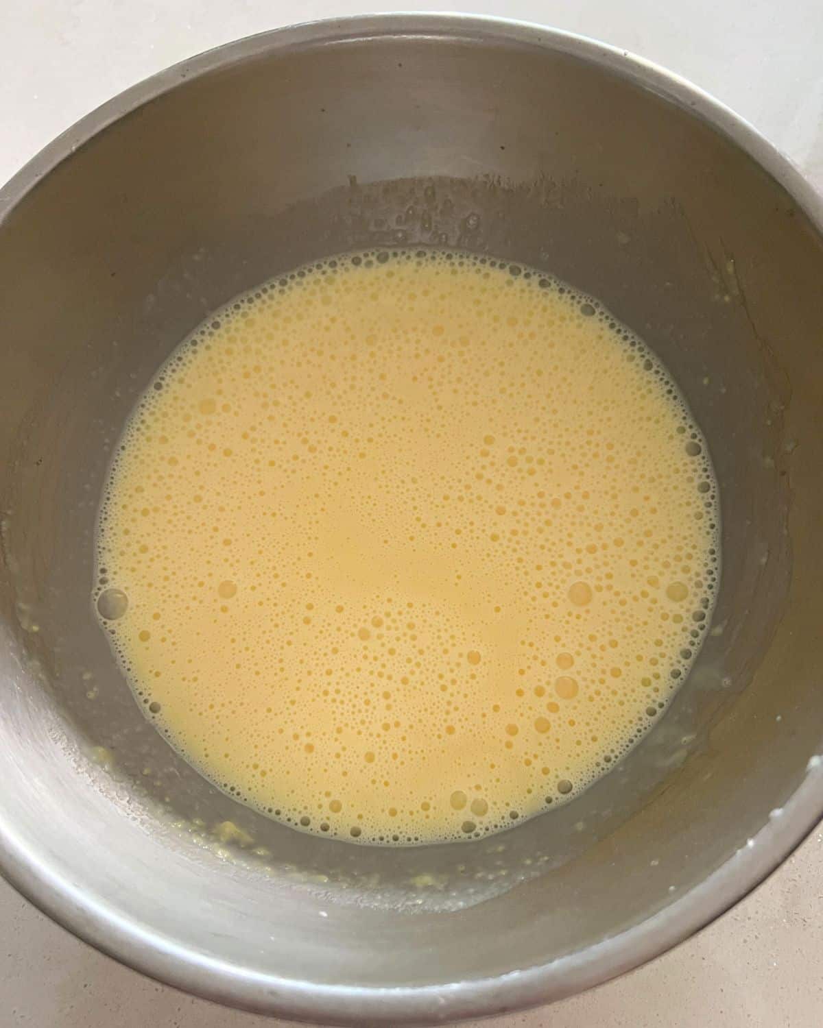 Vanilla pudding and milk in a bowl.