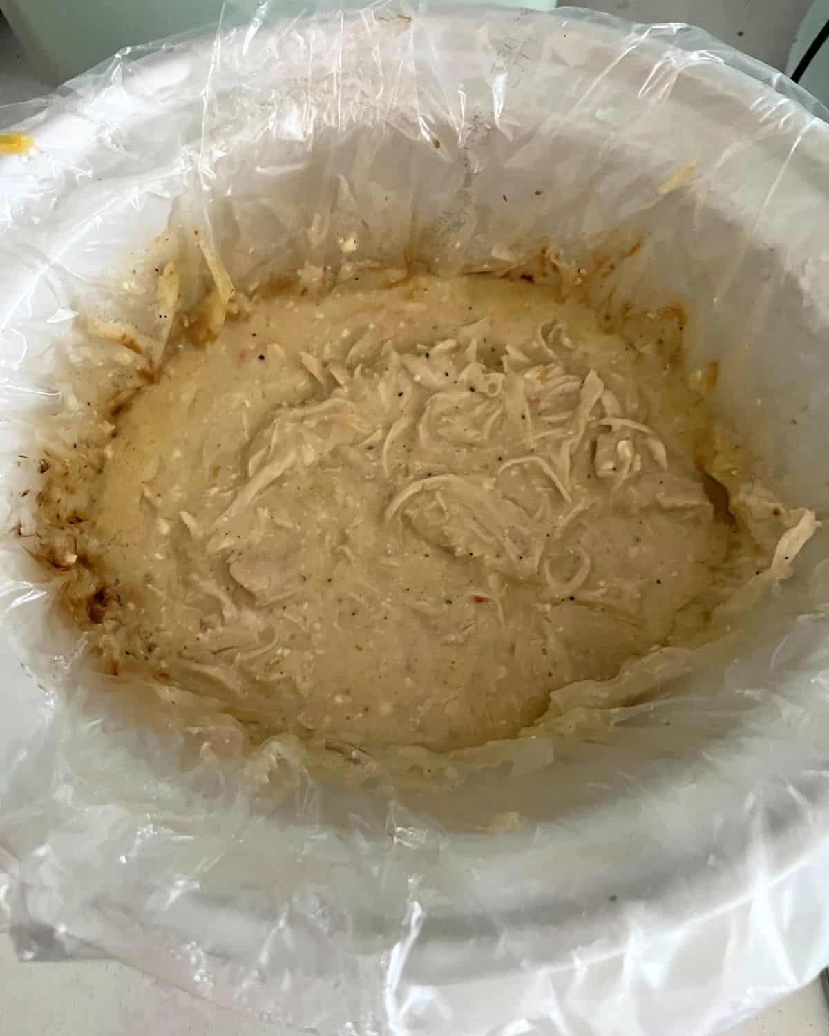 Shredded chicken in a crock pot. 