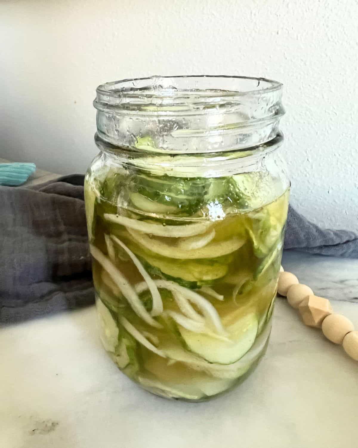 Easy homemade refrigerator pickles in a glass jar. 