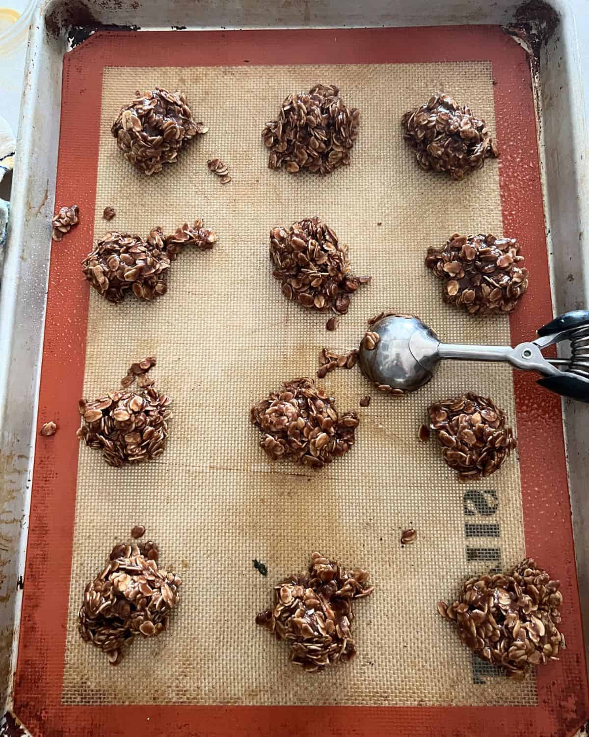 No bake cookies scooped out on a sheet pan. 