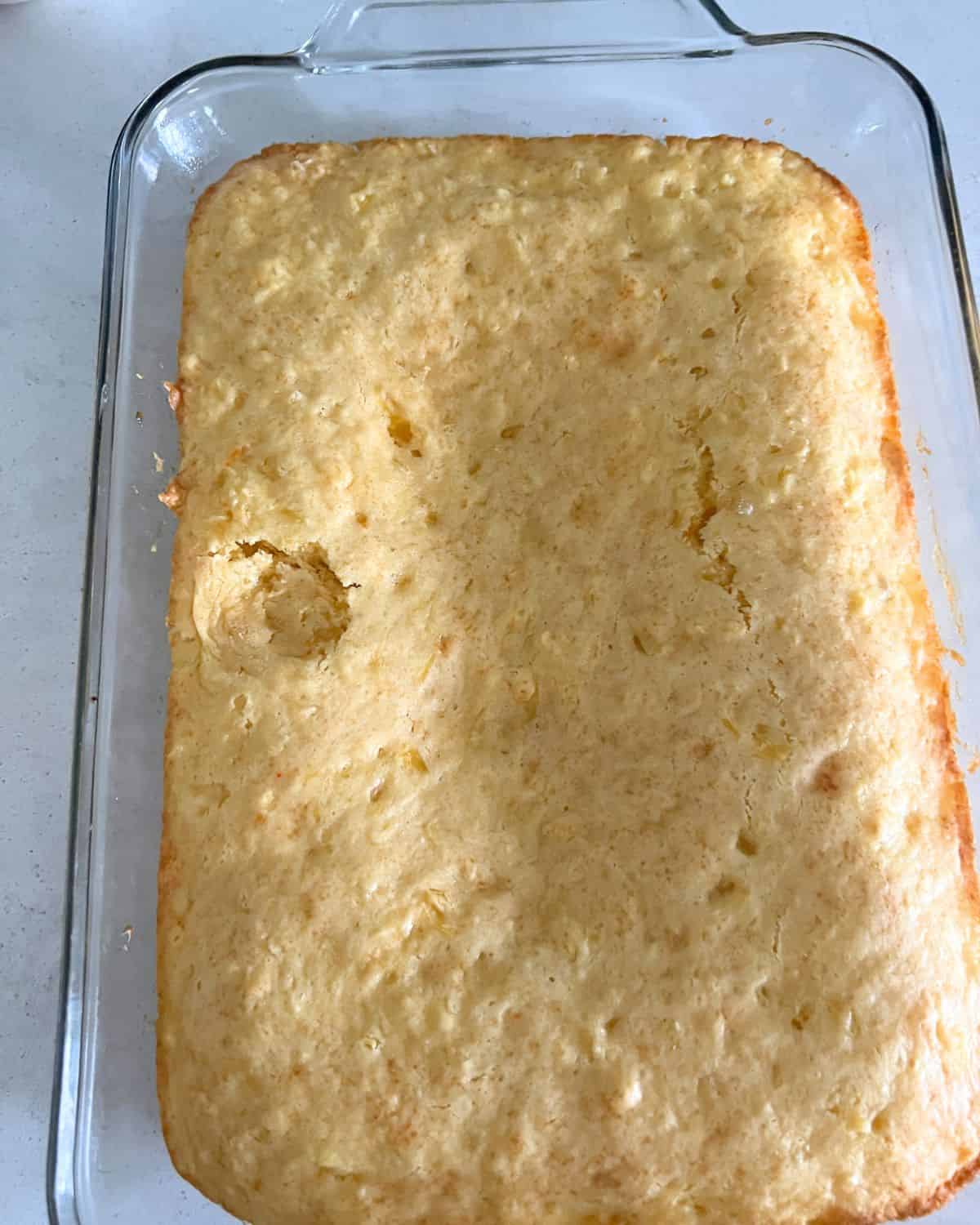 Baked pineapple cake mix in a pan. 