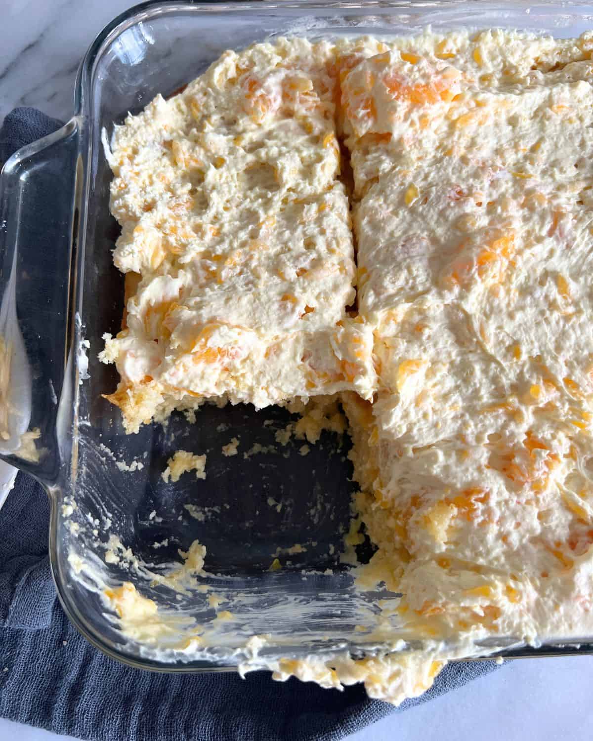 Pineapple cake mix topped with frosting.