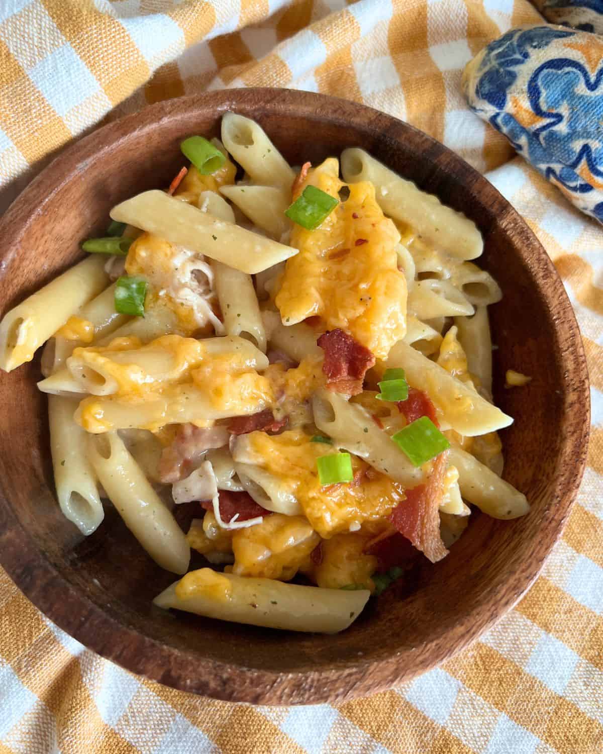 Chicken Bacon Ranch pasta in a brown serving bowl. 