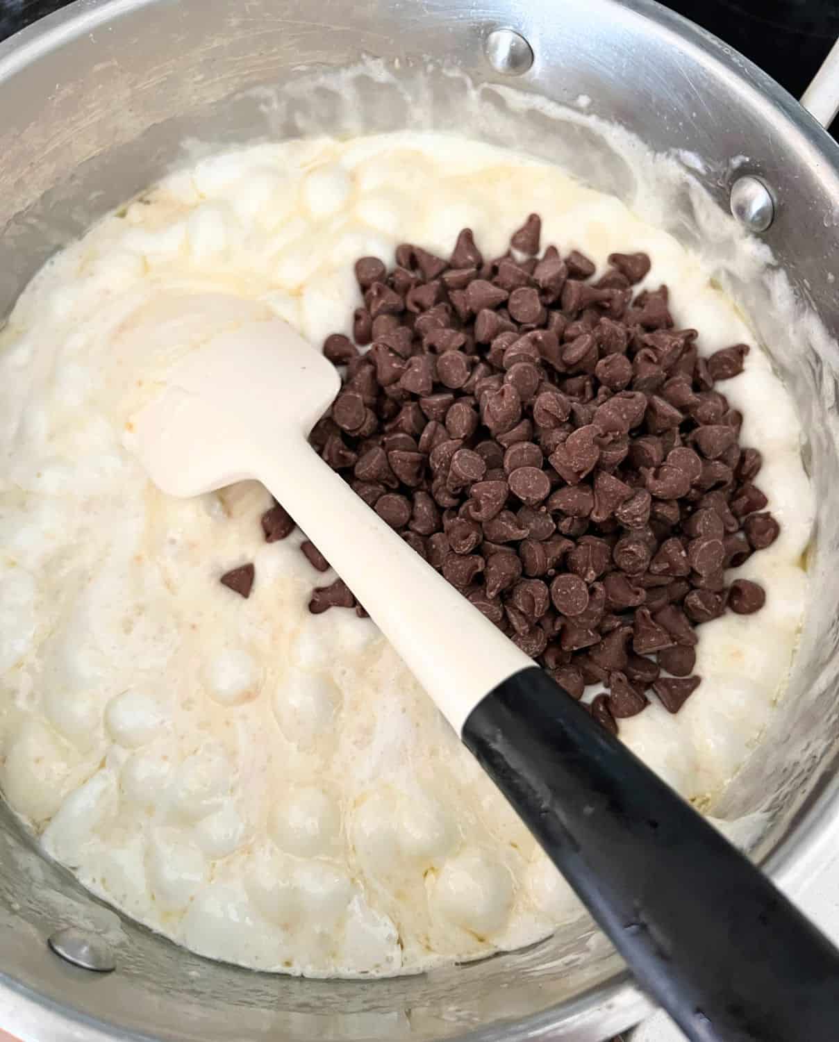 Marshmallows, butter, and chocolate chips in a sauce pan. 